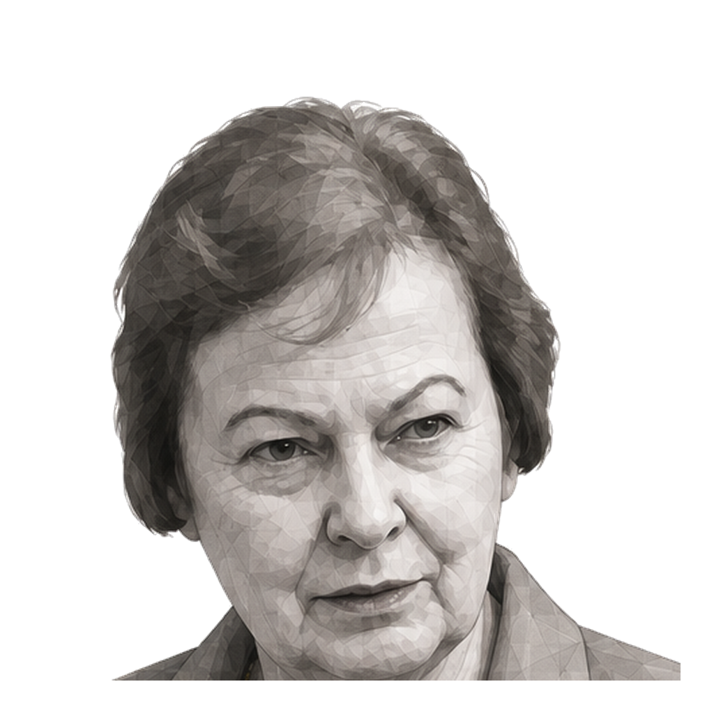 Nel Noddings in a three-quarter shaded warm-grey editorial portrait, wearing a simple muted-gold necklace with both hands open in conversation.